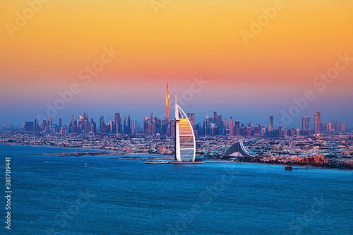 Obraz na płótnie Dubai city - amazing city center skyline and famous Jumeirah beach at sunset, United Arab Emirates w salonie