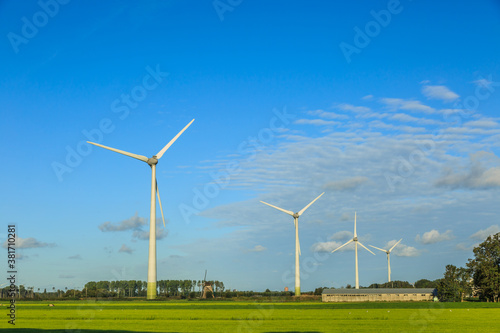 Dutch polder landscape with modern windturbines for the sustainable production of electricity for the climate-neutral production of Heineken Beer for the Dutch and European markets