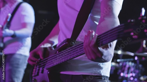 Playing bass guitar in a band