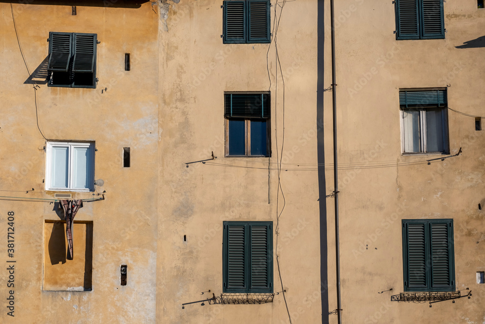 Facade of a Old Building with Windows in a Medieval Town of Tuscany
