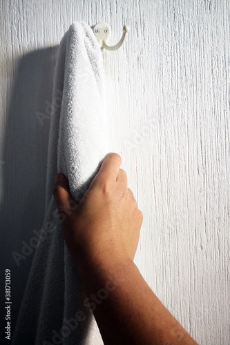 close up of a hand holding a towel