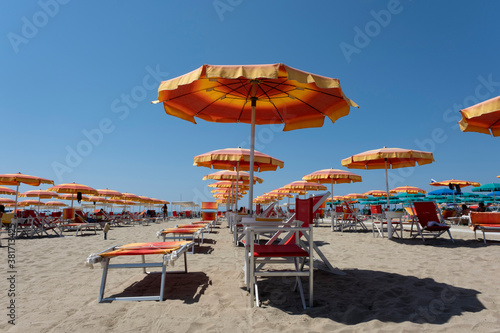 Fototapeta Naklejka Na Ścianę i Meble -  Summer beach landscape with umbrellas and beach chairs