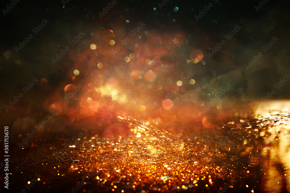 background of abstract gold and black glitter lights. defocused background of abstract gold and black glitter lights. defocused
