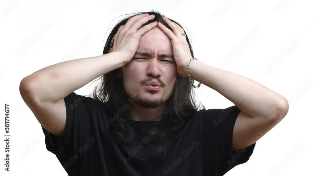 Close-up of shocked east-asian male rocker, punk guy with long hair and moustache cringe from something awful, see bad situation and grimacing, standing over white background Close-up of shocked east-asian male rocker, punk guy with long hair and moustache cringe from something awful, see bad situation and grimacing, standing over white background