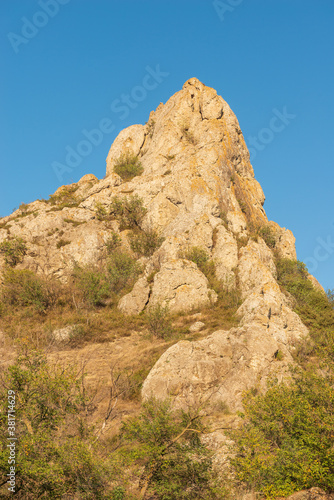 Landscape of the Crimean mountains, local attraction mount Bal Kaya in the village of Kurortnoye, the mountain serves as a landmark and a lighthouse in the daytime