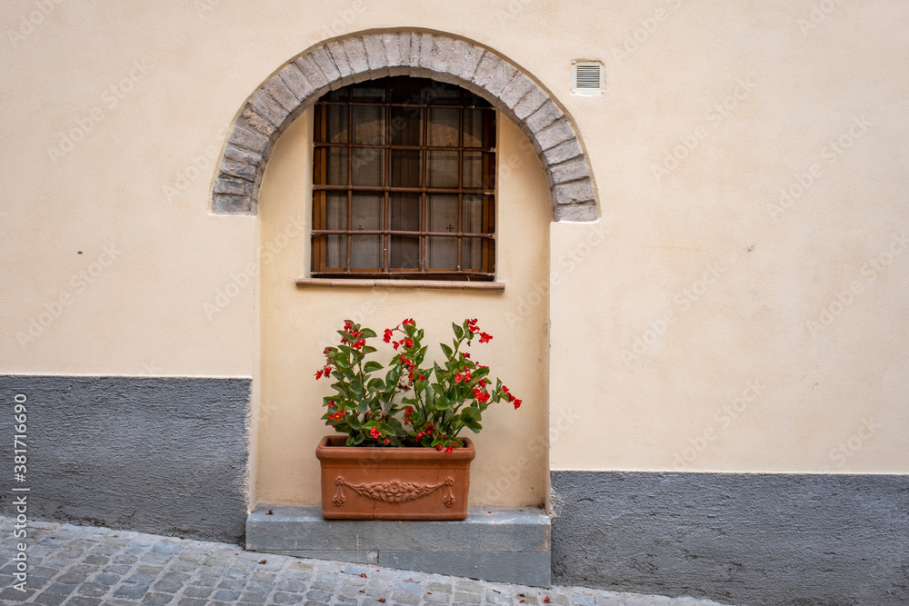 Spello, Perugia, Umbria, Italy. Typical alley with potted plants and flowers