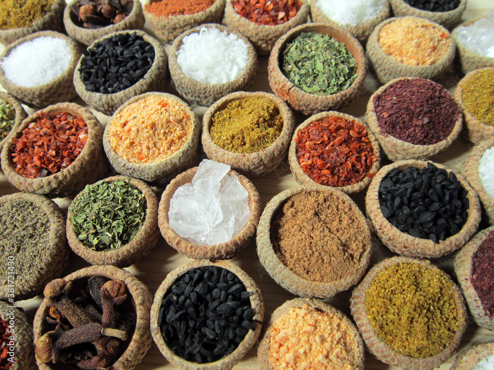        Colorful, aromatic spices on a wooden background   