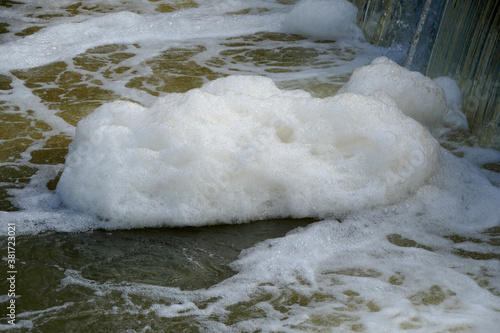 Foaming unclean water, concept of pollution and water contamination