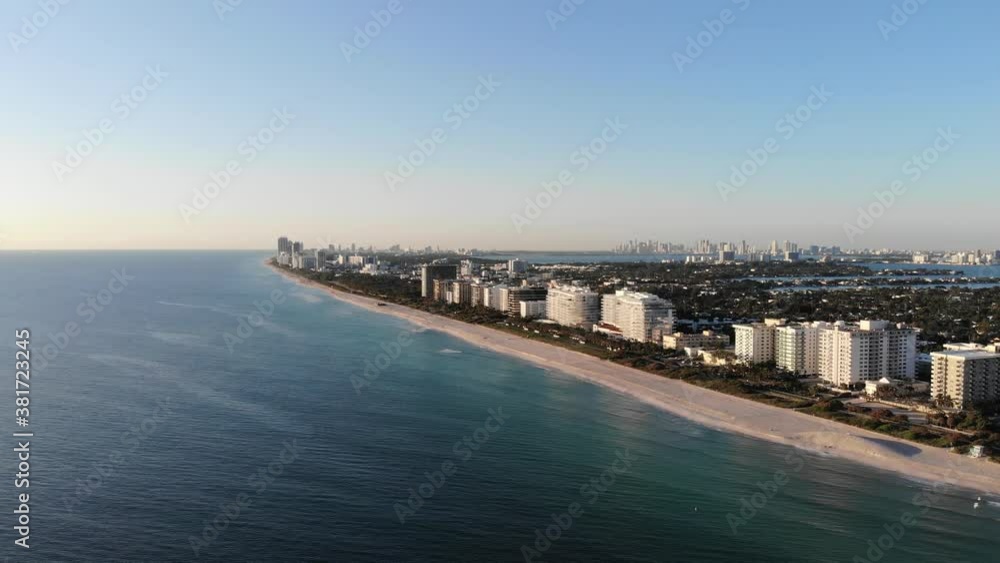 Stunning surfside Florida coastline at sunset with hotels and pristine white sand beaches Stunning surfside Florida coastline at sunset with hotels and pristine white sand beaches