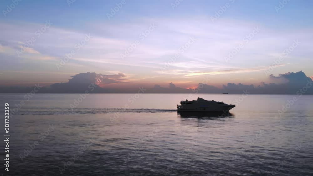 Calm ocean waters with luxury boat at sunset off the Florida Coast Calm ocean waters with luxury boat at sunset off the Florida Coast