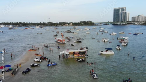 Boat party meet up with hundreds of people at mass gathering of boats in Haulover Sandbar photo