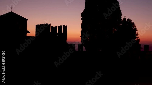 Medieval castle silhouette  at sunset photo