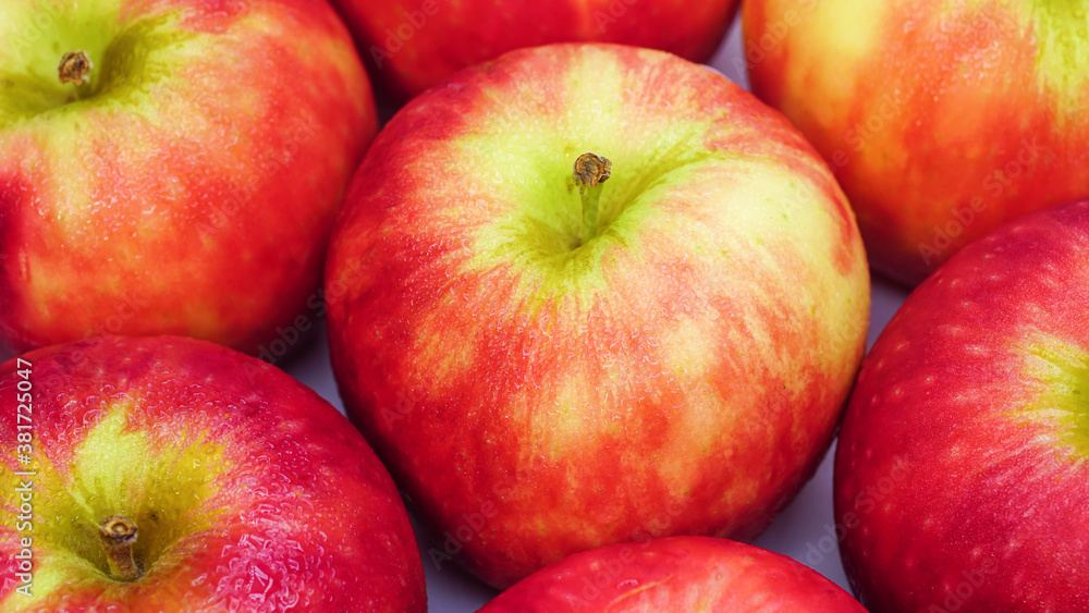 Fresh red apples with drops of water, closeup.
Fresh red apples with drops of water, closeup.