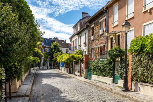 Fototapeta Naklejka Na Ścianę i Meble -  Paris, France - September 9, 2020: Beautiful old house, like in the countryside, in the center of Paris, in the area called 