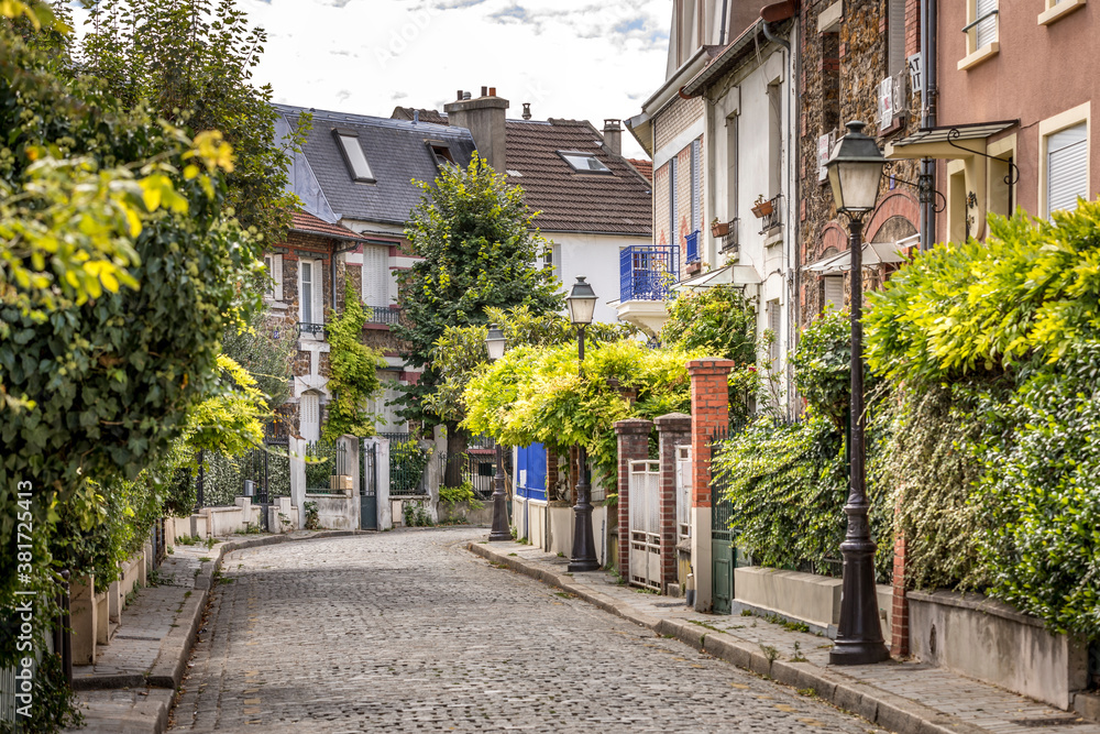 Paris, France - September 9, 2020: Beautiful old house, like in the countryside, in the center of Paris, in the area called Paris, France - September 9, 2020: Beautiful old house, like in the countryside, in the center of Paris, in the area called
