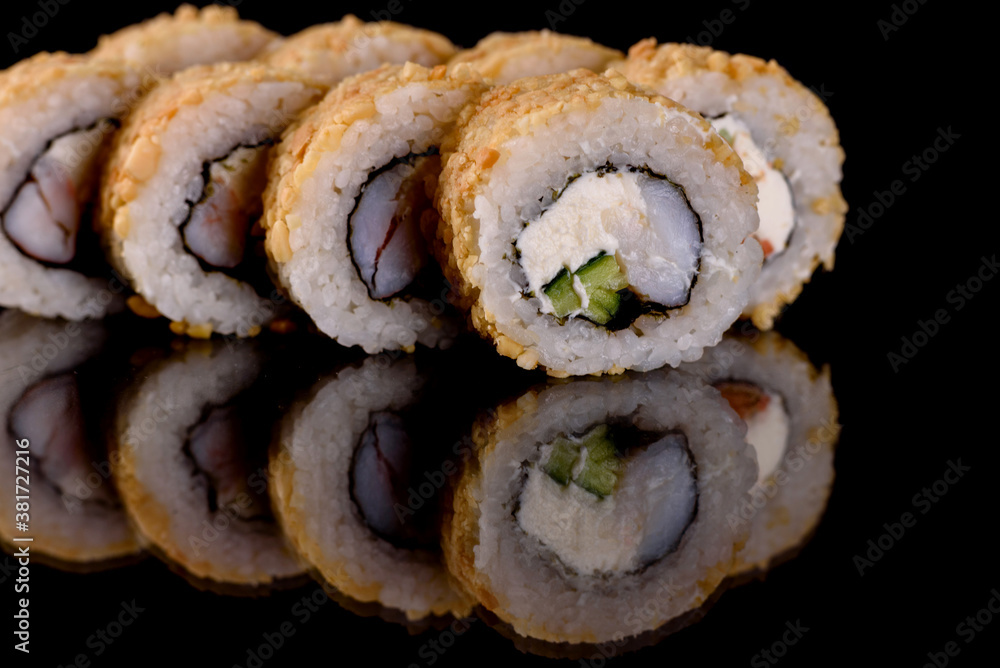 Fresh delicious beautiful sushi rolls on a dark background Fresh delicious beautiful sushi rolls on a dark background