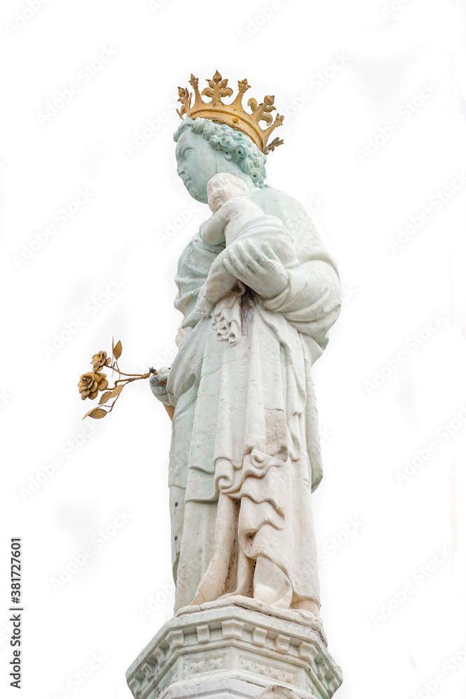 Ancient aged sculpture of beautiful Venetian Noble Renaissance Era woman with a child at Basilica di Santa Maria della Salute in Venice, Italy, isolated at white background, closeup, details