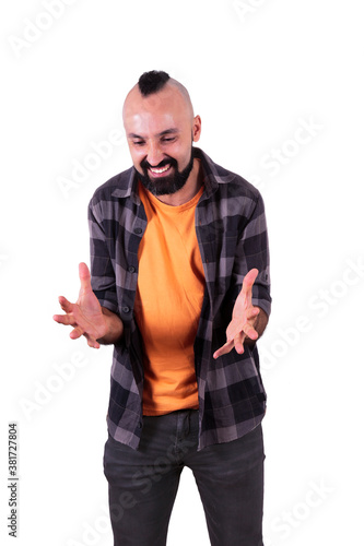 Furious young hispanic man in casual clothes expressing anger