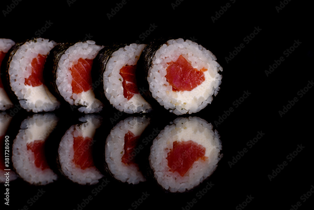 Fresh delicious beautiful sushi rolls on a dark background Fresh delicious beautiful sushi rolls on a dark background