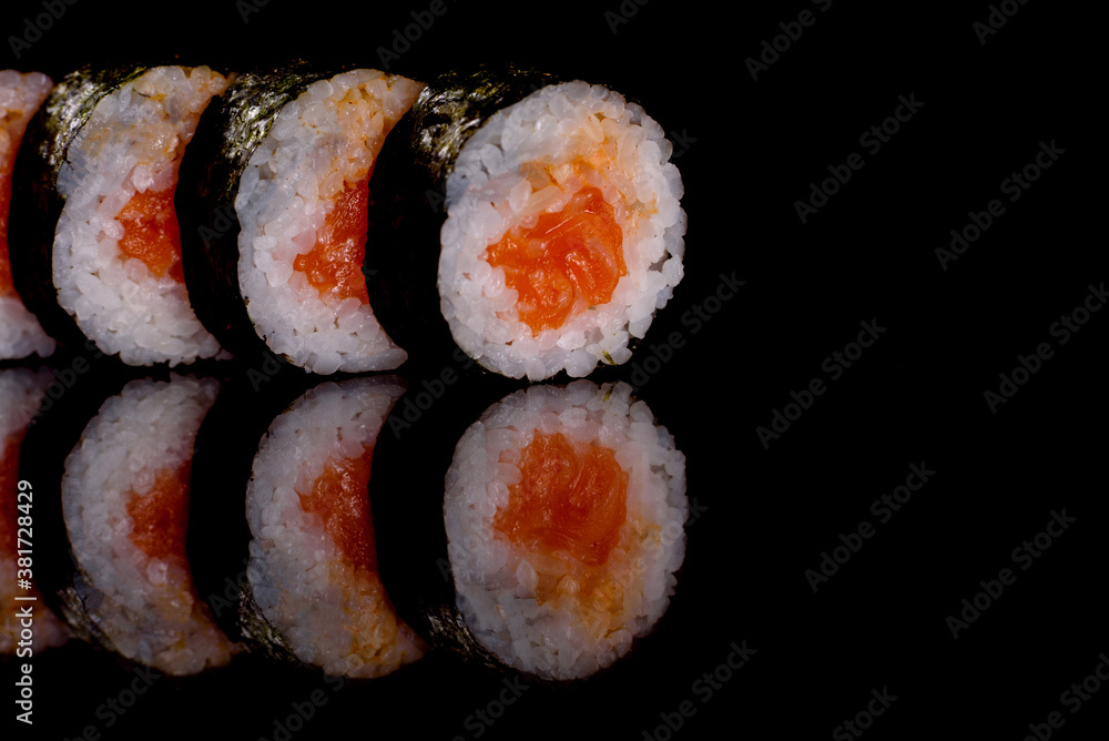 Fresh delicious beautiful sushi rolls on a dark background Fresh delicious beautiful sushi rolls on a dark background