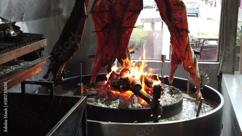 
Lamb An asado is a roasted meat of beef or various other meats, which are cooked on a typical barbecue with vertical grills placed around at fire and embers in a big brazier. It is a traditional dish photo