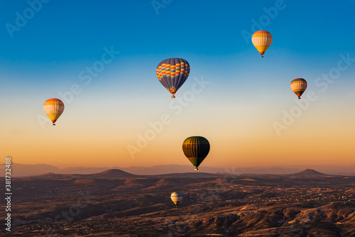 Hot air balloons  at sunrise in  Goreme National Park, Cappadocia, Turkey. © sola_sola