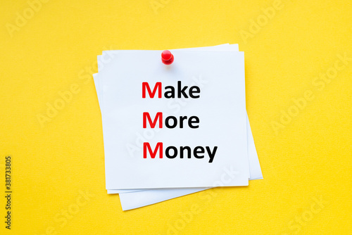 Word make more money on white sticker with yellow background. Motivational Business.