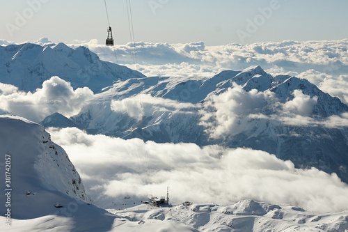 Ski lift cabins in snowy mountains in Les 2 Alpes