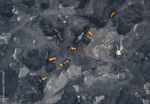 Coal mining an open pit extractive industry, top view aerial