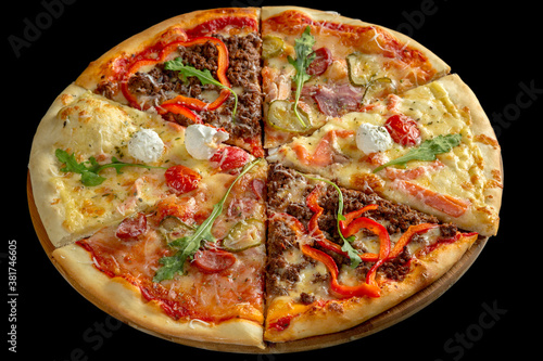 Assorted several types of pizza. Black background.