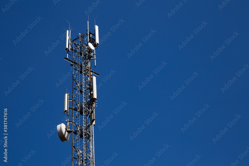 Mast of the cellular network over the blue sky Mast of the cellular network over the blue sky