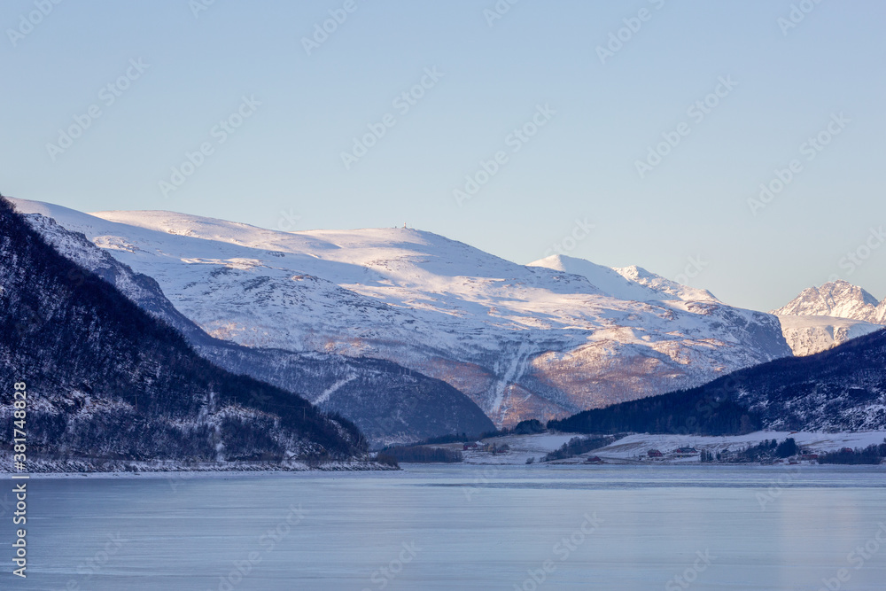Winter landscape with mountains and sea