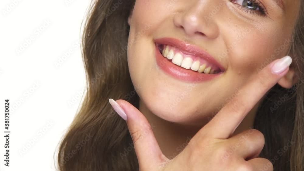 close-up of pretty woman mouth with beautiful teeths close-up of pretty woman mouth with beautiful teeths