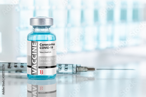 Coronavirus COVID-19 Vaccine Vial and Syringes On Reflective Surface Near Test Tubes