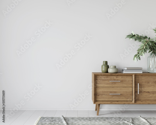 Interior with a wooden chest of drawers and green decor photo