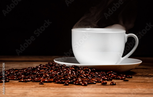 Freshly brewed coffee cup with coffee beans.