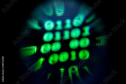Blurry background with an abstract blur circle with a binary code. Blurry background. Abstract object in blur. © Azazello