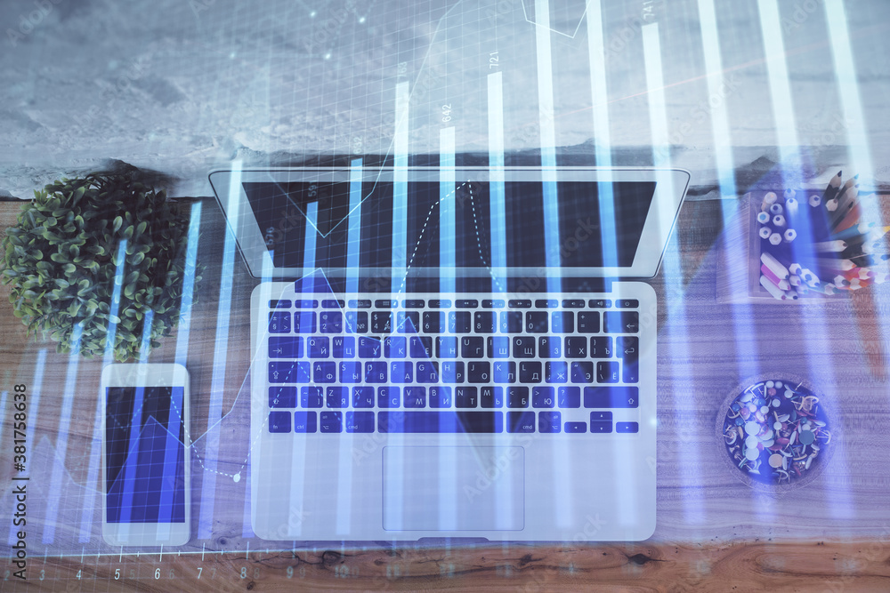 Multi exposure of financial chart drawing over table background with computer. Concept of research and analysis. Top view.