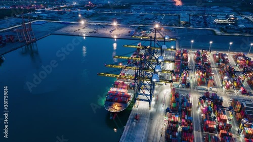 Time lapse Container , container ship in export and import business and logistics. Shipping cargo to harbor by crane. Water transport International. Aerial view and top view.
