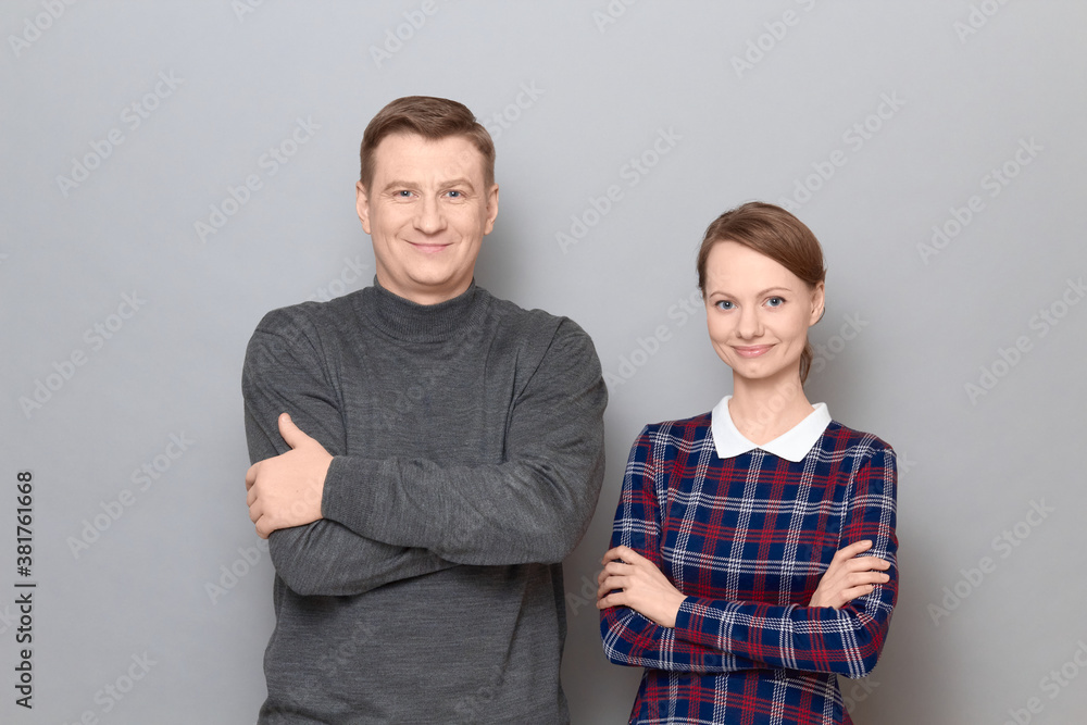 Portrait of happy joyful man and woman standing together and smiling Portrait of happy joyful man and woman standing together and smiling