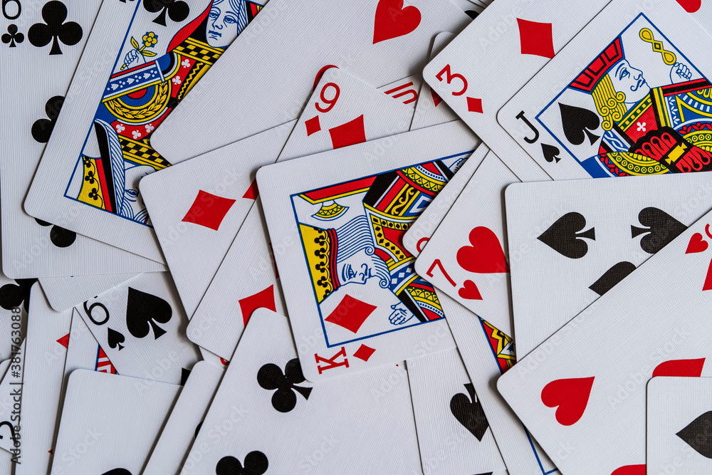 Mixed playing cards on a table