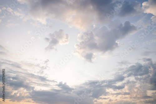 Beautiful evening sky. Scenic sky background. Warm sky with delicate clouds