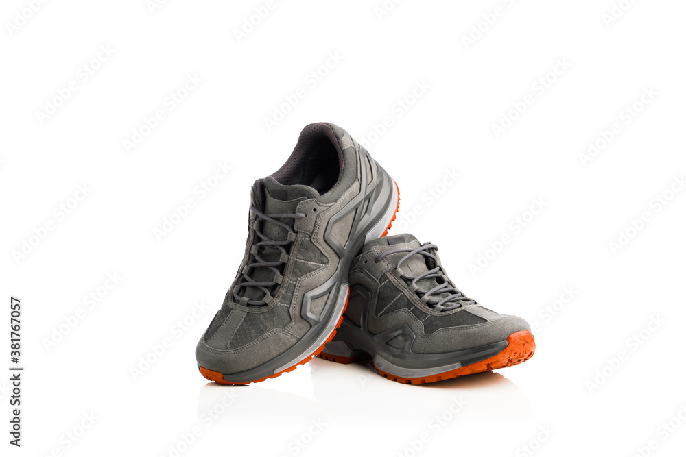 trekking sneakers with red sole, isolated on white