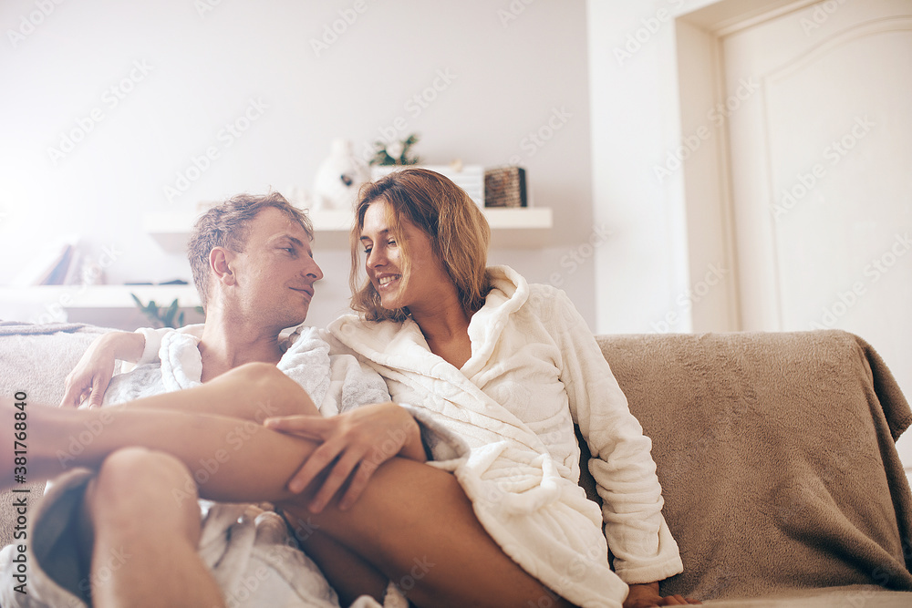 Smiling lovely young couple relaxing. Couple in love. Happy day. Good morning. Smiling lovely young couple relaxing. Couple in love. Happy day. Good morning.