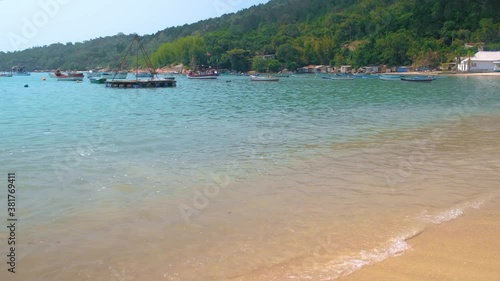 fishing boats on the beach on a sunny day