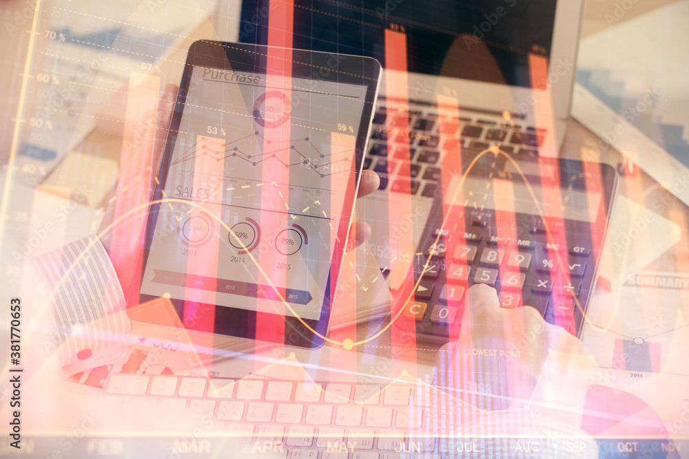 Double exposure of man's hands holding and using a digital device and forex graph drawing. Financial market concept. Double exposure of man's hands holding and using a digital device and forex graph drawing. Financial market concept.