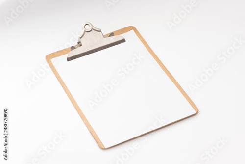 Clipboard with a blank sheet of paper isolated on white background.