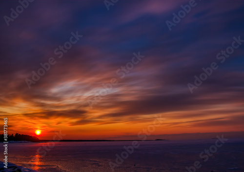 Pictures of a sunset on the frozen Baltic Sea near the Finnish town of Rauma