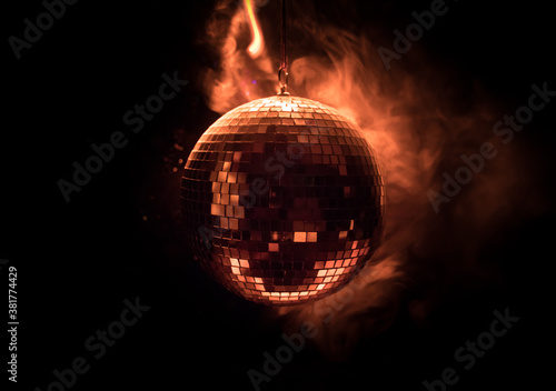 Colorful disco mirror ball lights night club background. Party lights disco ball. Selective focus photo