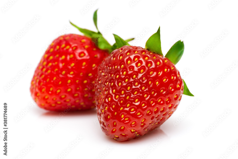 two ripe juicy strawberries on a white background